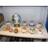 A collection of ceramic and other eggs