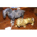 A cast metal lion ornament together with cast meta