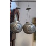 A pair of pierced metal Persian lamp globes - appr