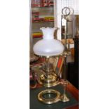 A 65cm high brass students oil lamp with milk glas