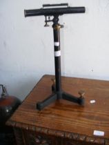 An antique Philip Harris mounted level on stand