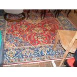 A large Middle Eastern carpet with geometric borde