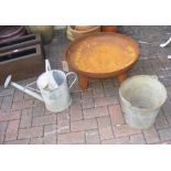 A galvanised watering can and bucket together with