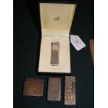 A vintage Dunhill lighter together with three others