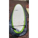 An Elements 7ft 6 surfboard with case and leash