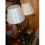 A pair of poseable arm table lamps