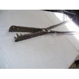 An unusual pair of antique cast metal tongs - 115c