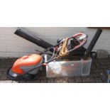 An electric Flymo hoover vac, hedge cutter, garden