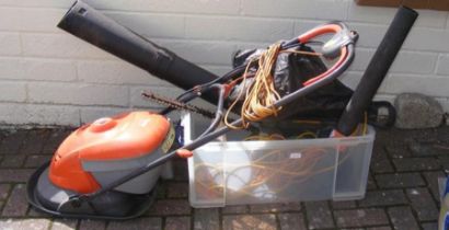 An electric Flymo hoover vac, hedge cutter, garden
