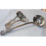 A large silver ladle, together with two smaller di