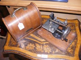 A vintage Lead sewing machine in carrying case