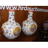 A pair of large Oriental vases with butterfly and