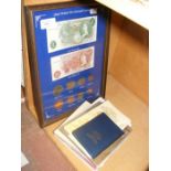 A quantity of UK coinage in display case and books