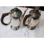 A silver hammered coffee pot with matching water p
