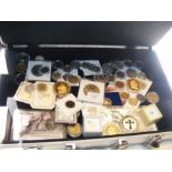 A case of collectable coins, silver and other