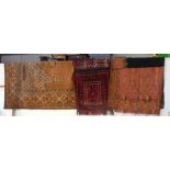 A Middle Eastern rug, saddle back pad and a paisle