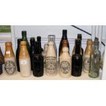 A quantity of stoneware and glass beer bottles