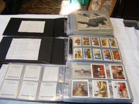 Three albums of collectable cigarette card sets, including Wills 1925 British Castles