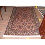 A Middle Eastern rug with geometric border - 220cm