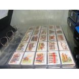 A large album containing collectable 1900-1920s cigarette card sets, including Players 1910 Army Lif