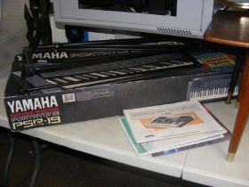 A Yamaha Portatone PSR-19 Electronic Keyboard with