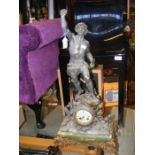 A French 'E. Lefort' mantel clock with statuette
