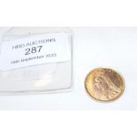 An 1887 gold half sovereign coin