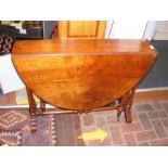 A large walnut antique Sutherland table