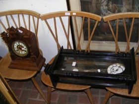 A hanging wall clock together with mantel clock