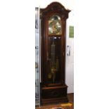 A modern three train chiming Grandfather clock