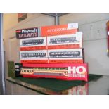 A selection of boxed Playcraft model railway coach