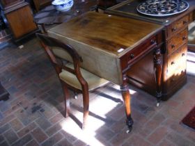 A mahogany drop leaf Pembroke table together with