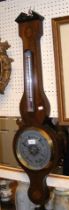 A reproduction wall barometer/thermometer