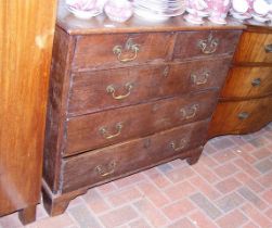 An antique oak country chest of two short and thre