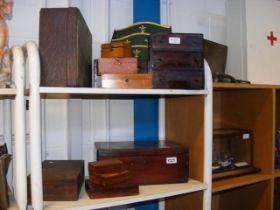 A number of old wooden boxes - on two shelves