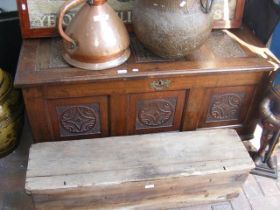 A panelled oak coffer with carved decoration - 128