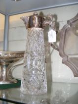 A silver lidded cut glass claret jug - 30cms high