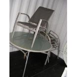 A circular chrome and glass top garden table, toge