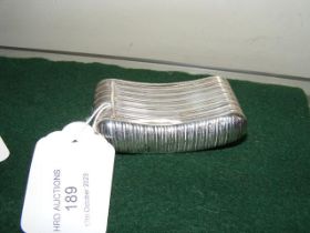 A silver snuff box of curved form - 6.5cms
