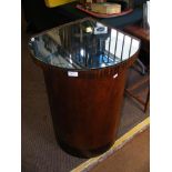 An Art Deco corner pedestal with mirrored top