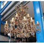 A large electric chandelier with cut glass droplet