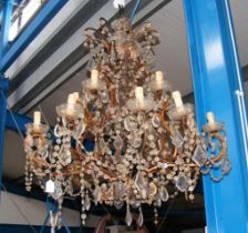 A large electric chandelier with cut glass droplet