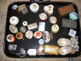 A silver oval pill box, silver matchstick box and