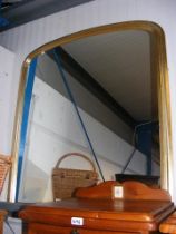 A gilt framed overmantel mirror