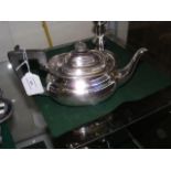 A small silver tea pot with Sheffield hallmark