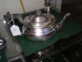 A small silver tea pot with Sheffield hallmark