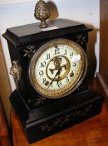 A 32cm high Victorian mantel clock with visible es