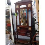 An Edwardian hall stand with mirrored back and til