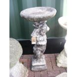 A figural stone birdbath - height 92cm