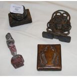 A cast metal Buddha and three metal chop seals